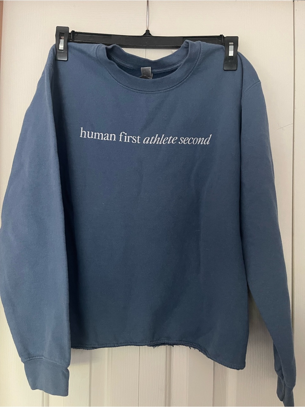 Blue Crewneck Sweatshirt with "human first athlete second" Text